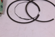 Load image into Gallery viewer, 1977-1978 YAMAHA DT400 NOS OEM 1ST OVER PISTON RINGS 1M2-11610-10